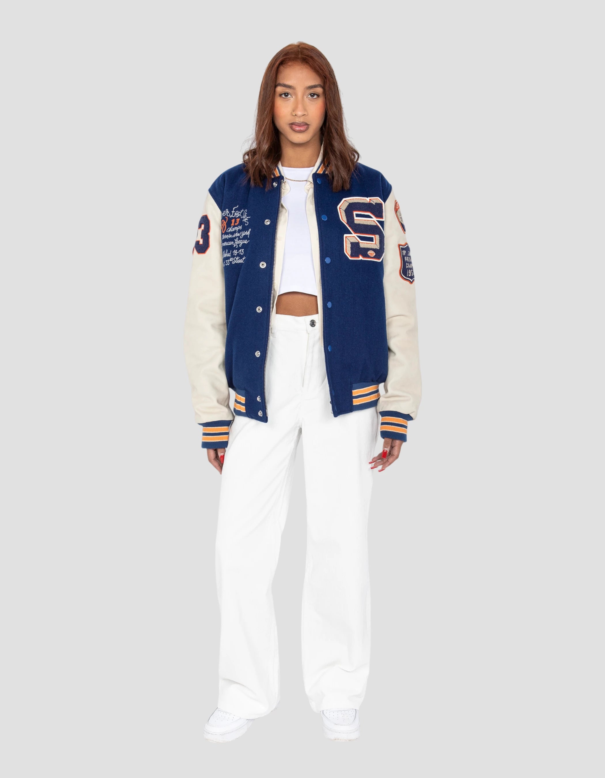 Blue and white embroidered teddy jacket, cowhide leather