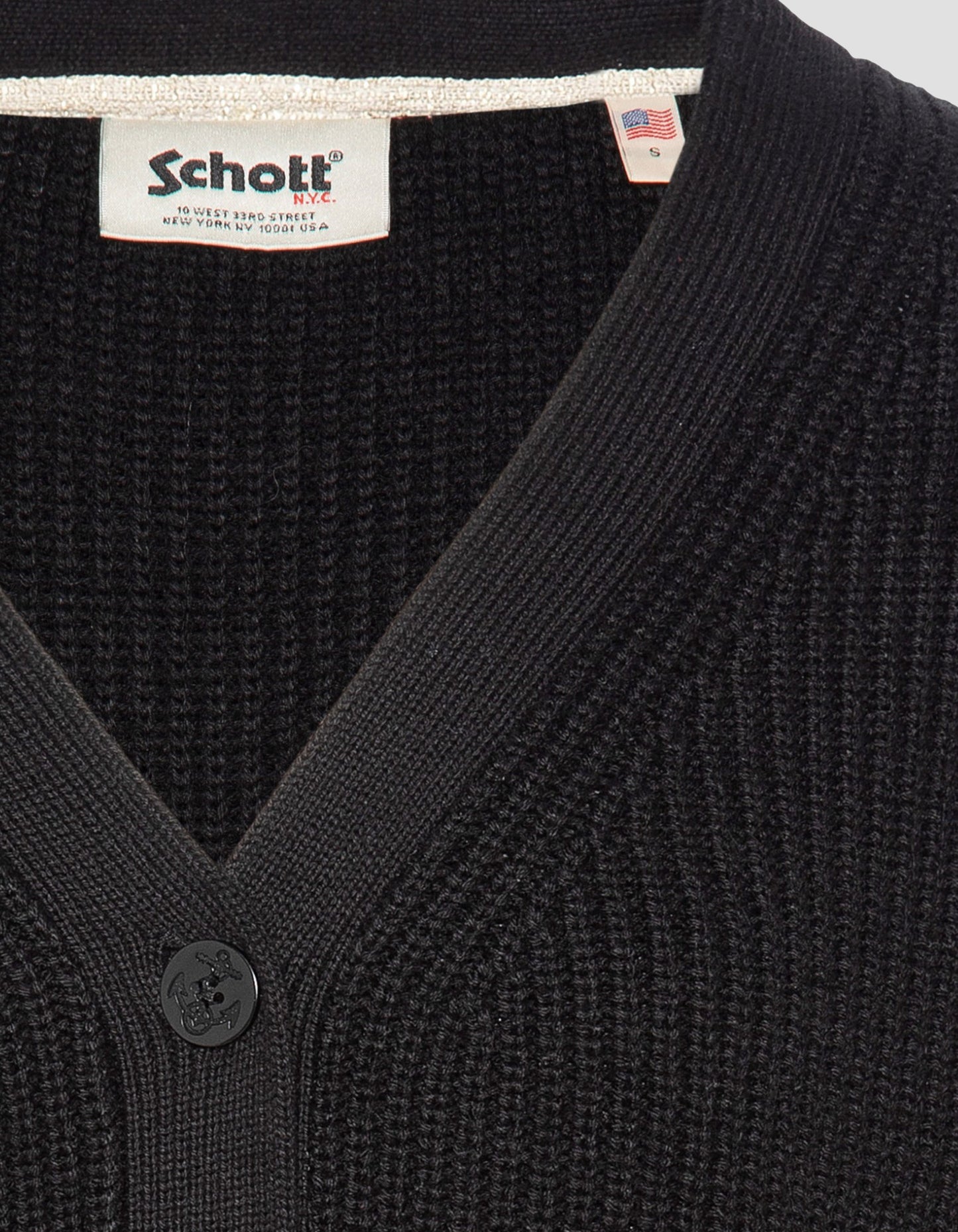 Kurze schwarze Strickjacke im gerippten Netz, große Größe