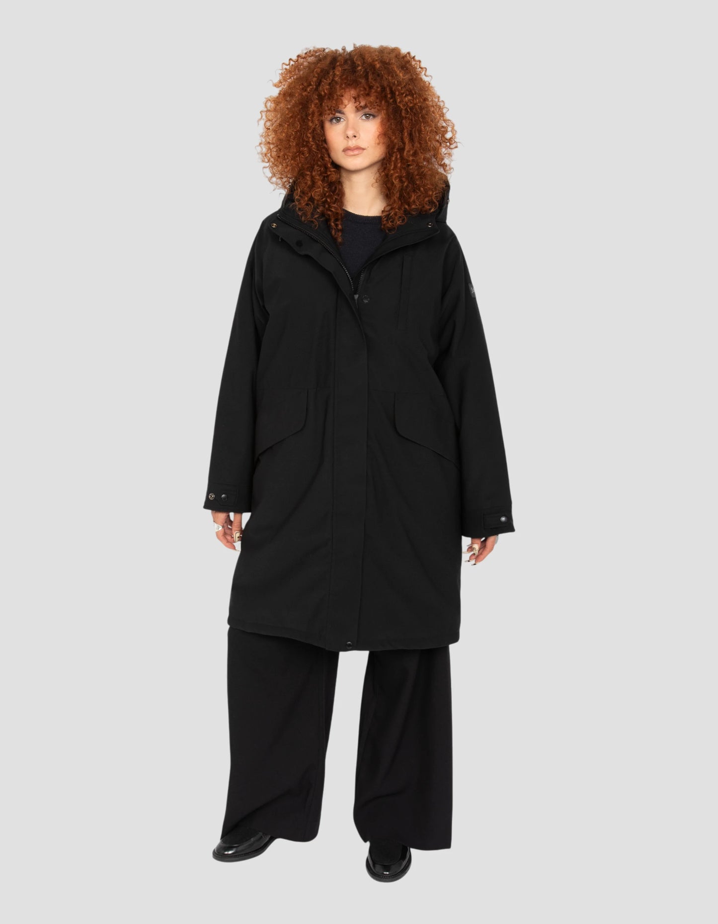 Multipoche nere con cappuccio