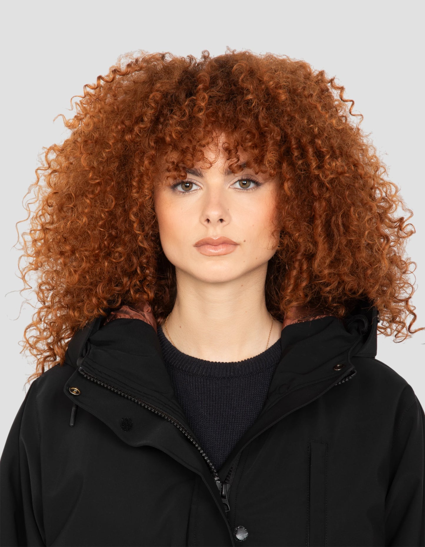 Multipoche nere con cappuccio