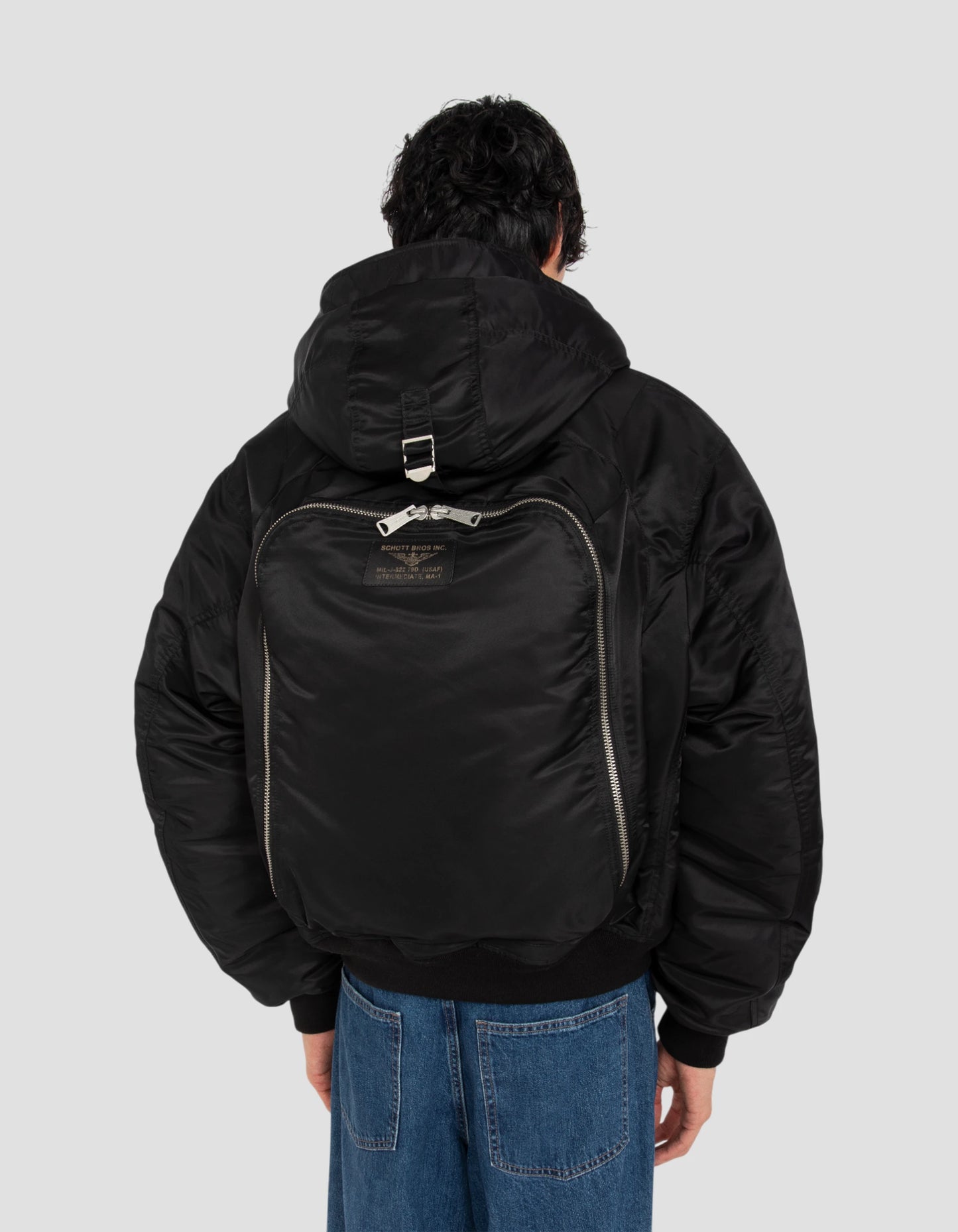 Schwarze Bomberjacke Typ N2B Motorhaube mit integriertem Rucksack