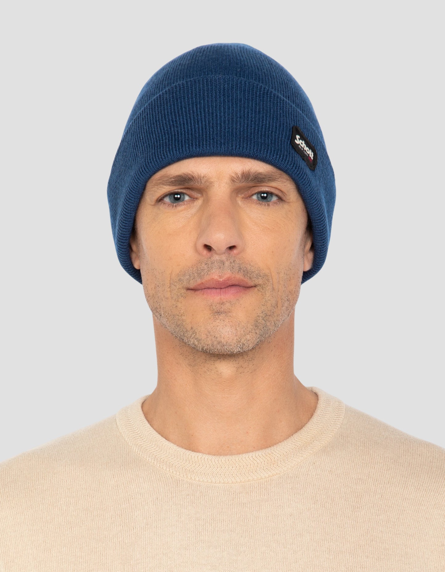 Bonnet à revers bleu en maille milano