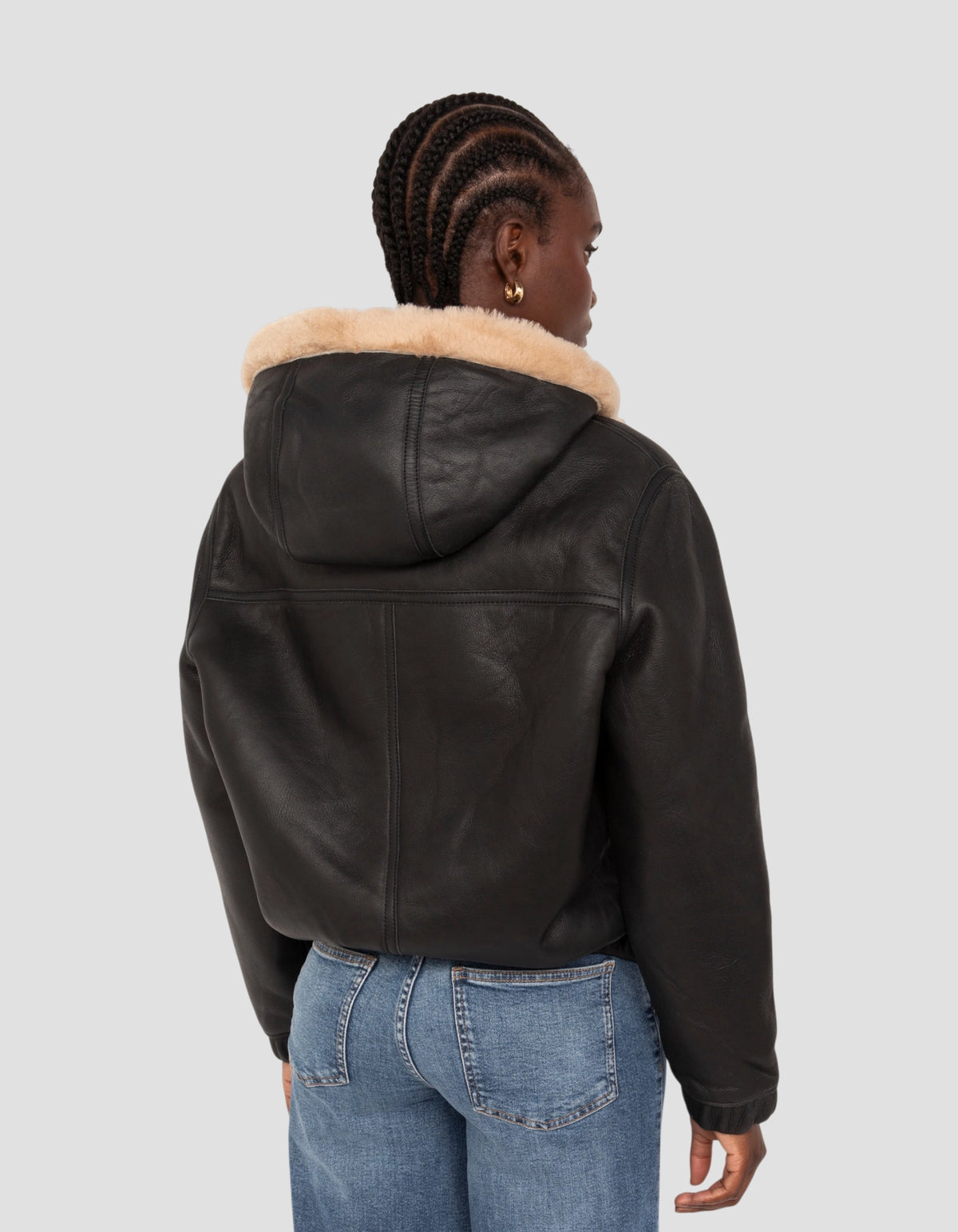 Giubbotto bomber nero e beige con cappuccio in montone double face