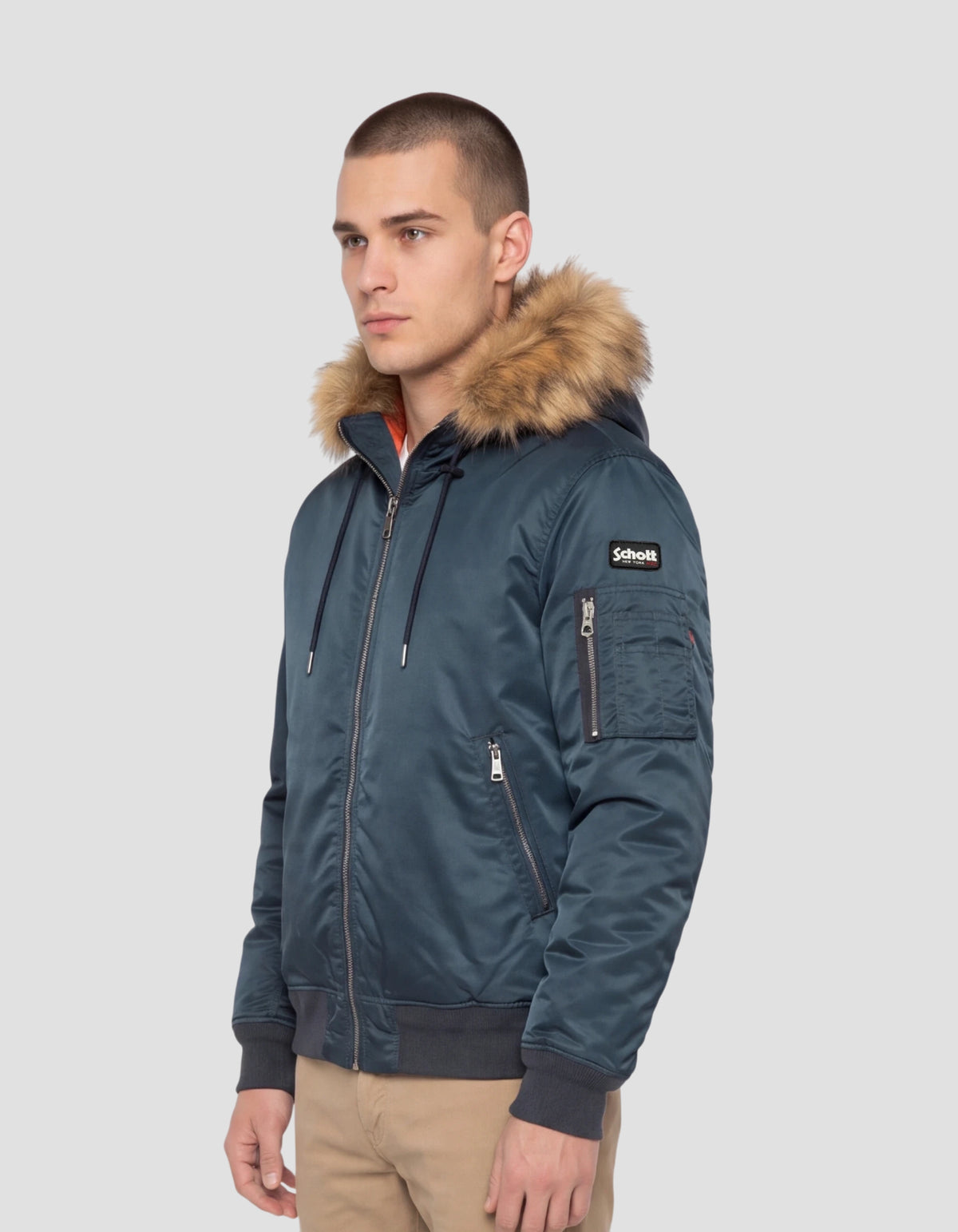 Cazadora bomber azul marino con capucha de pelo sintético