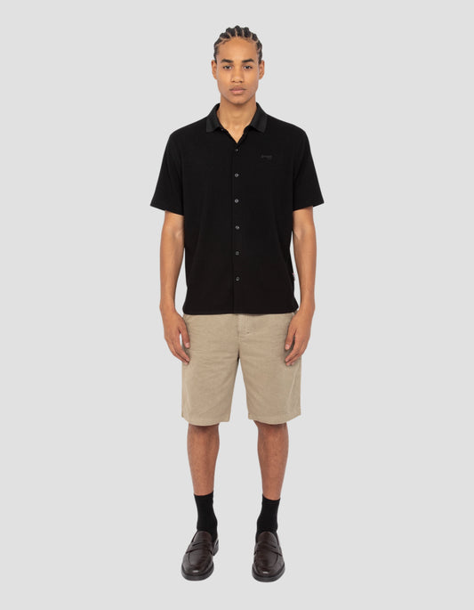 Waffle-effect knitted black shirt