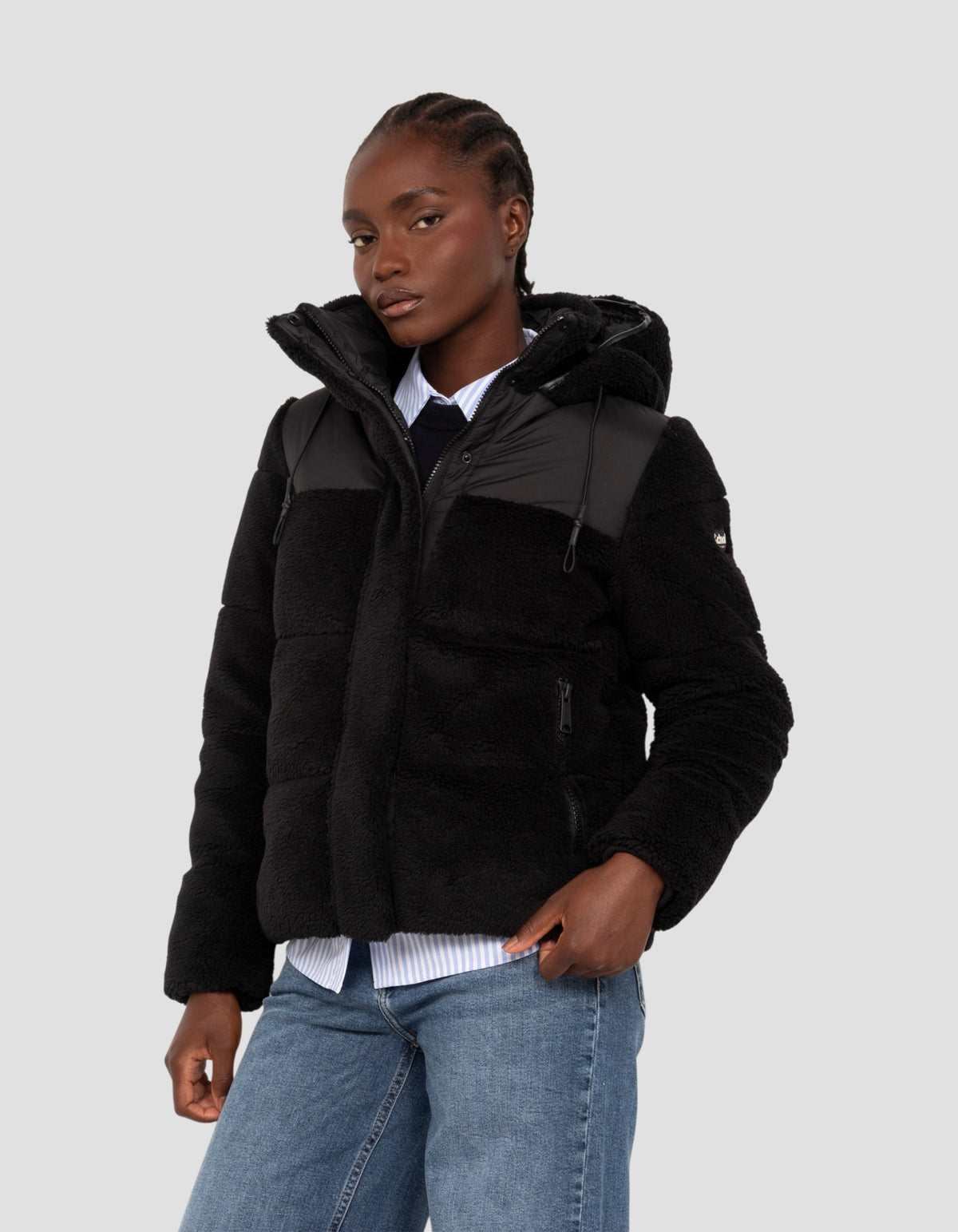 Piumino sherpa bimateriale nero con cappuccio