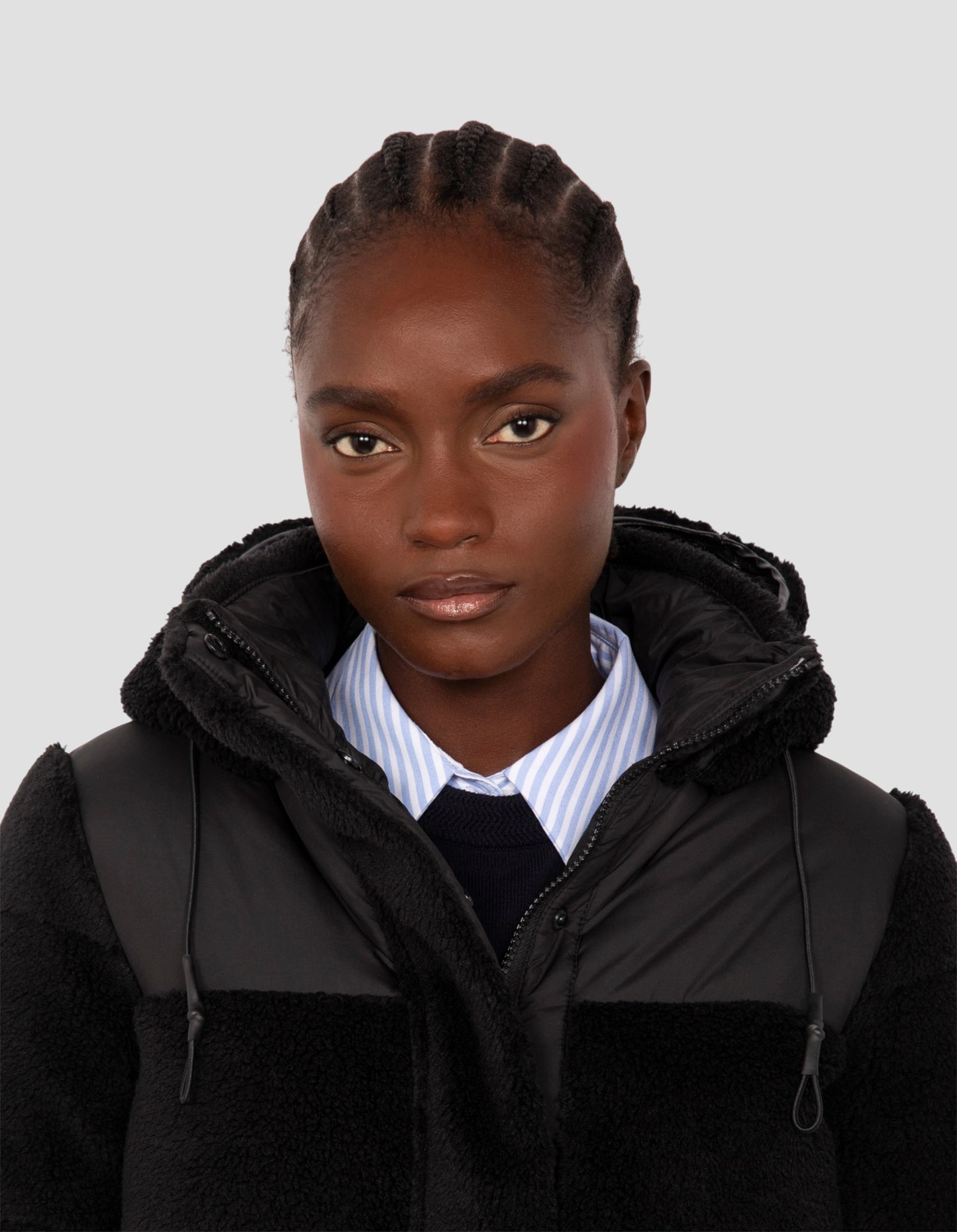 Piumino sherpa bimateriale nero con cappuccio