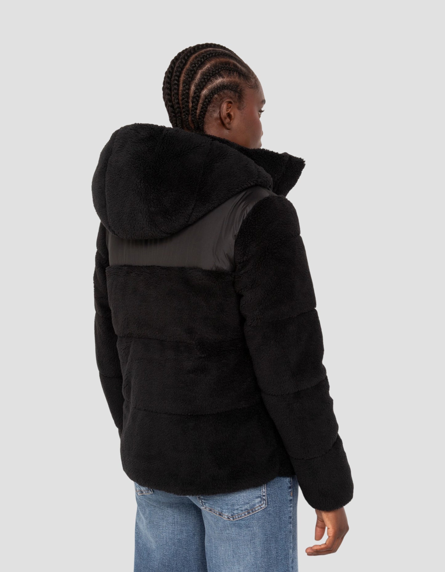 Piumino sherpa bimateriale nero con cappuccio